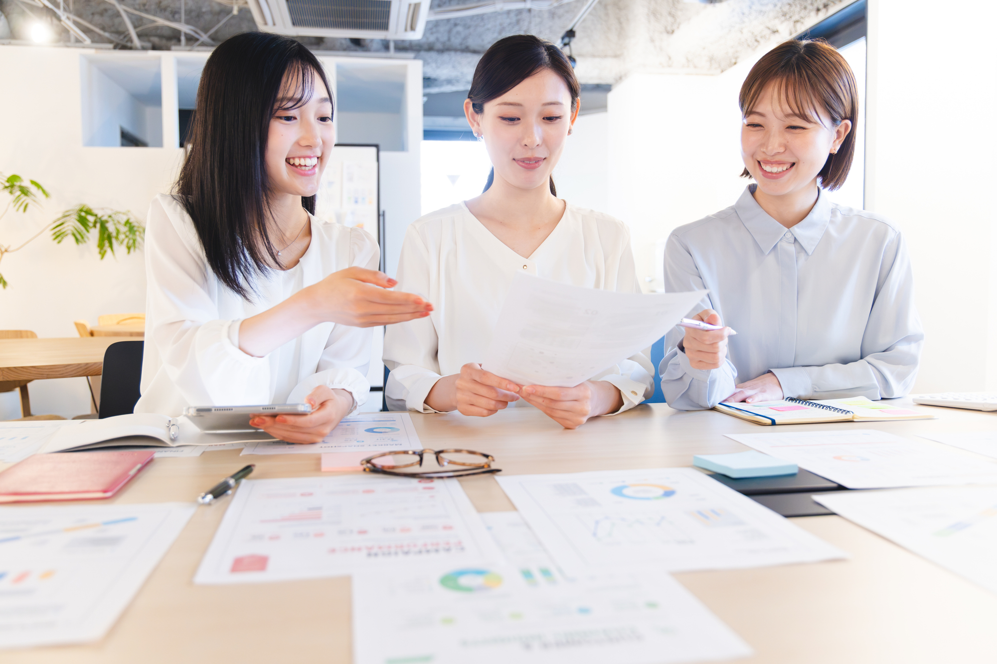 Business team exchanging ideas and reviewing documents in an office