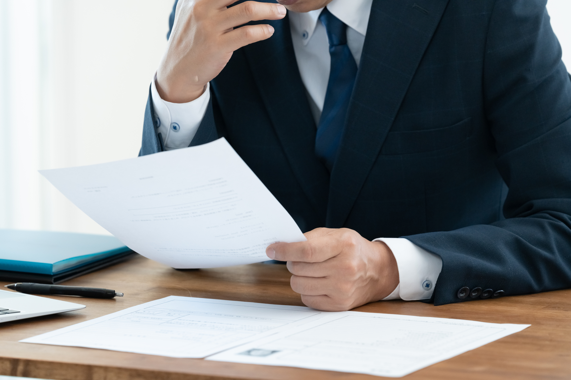 Recruitment professional reviewing candidate application documents